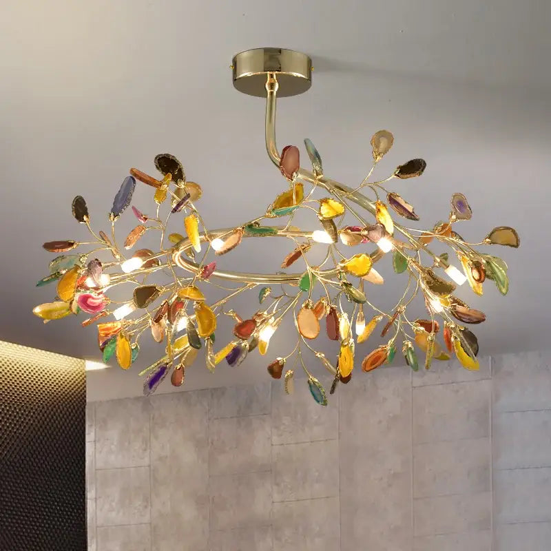 A decorbites colorful agate chandelier with golden leafy frame and translucent gemstone leaves for dining room and bedroom