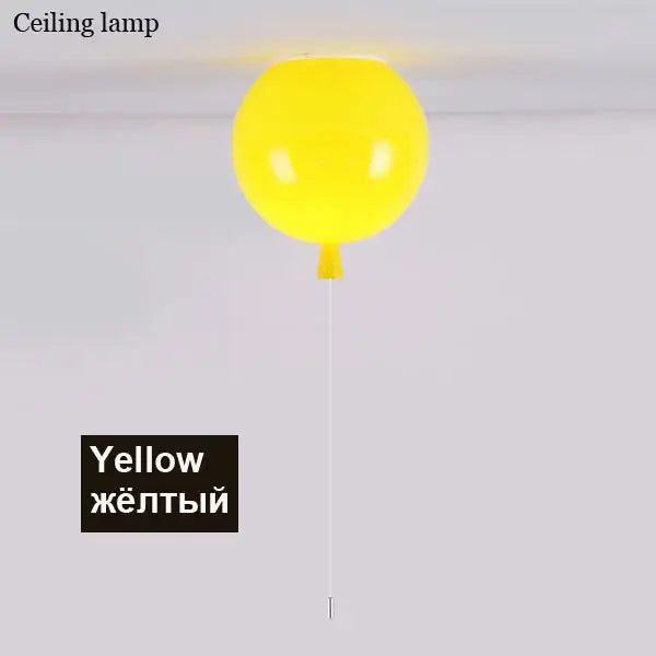 A bright yellow decorbites colorful balloon ceiling lamp with glossy finish and thin white cord for child bedroom