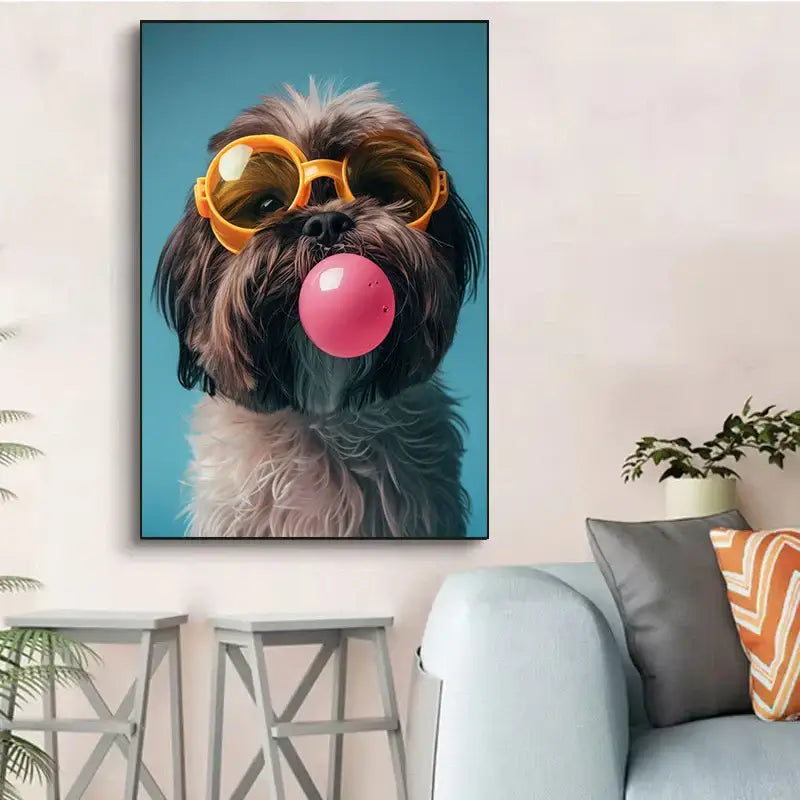 A framed canvas wall art featuring a fluffy brown and white dog wearing colorful dog sunglasses and blowing a bubblegum bubble