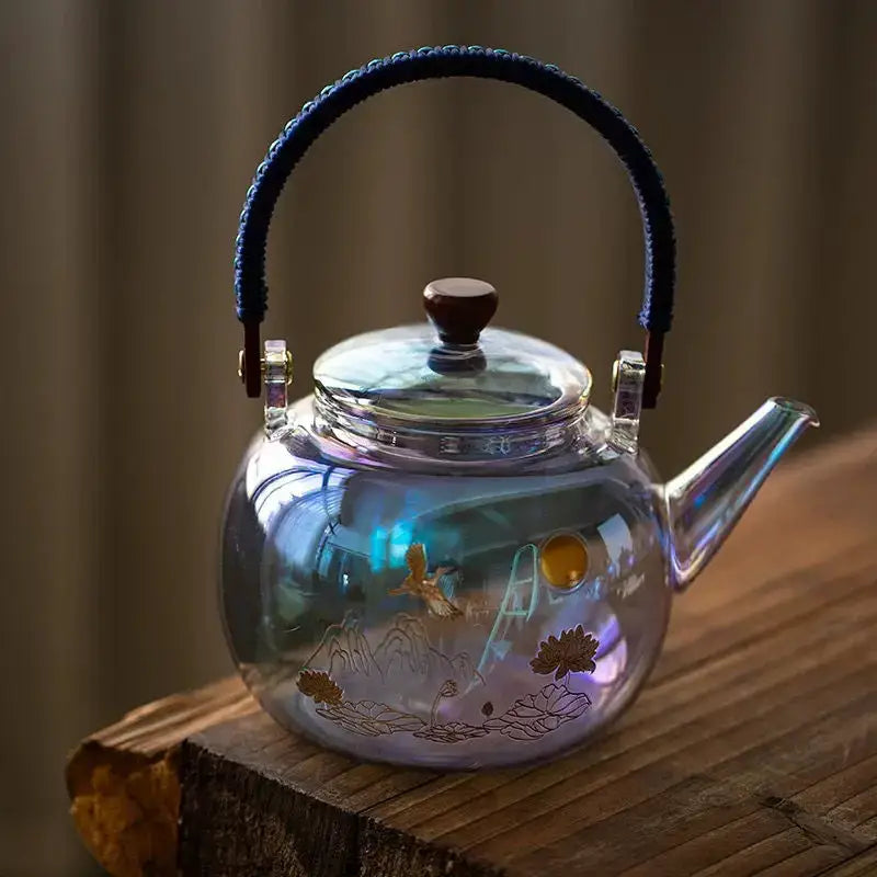 A translucent iridescent colorful enamel glass teapot with gold-etched lotus design by Decorbites colorful enamel