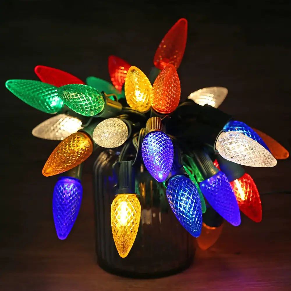 A festive string of decorbites colorful led faceted christmas outdoor lights with red green blue yellow orange and clear bulbs