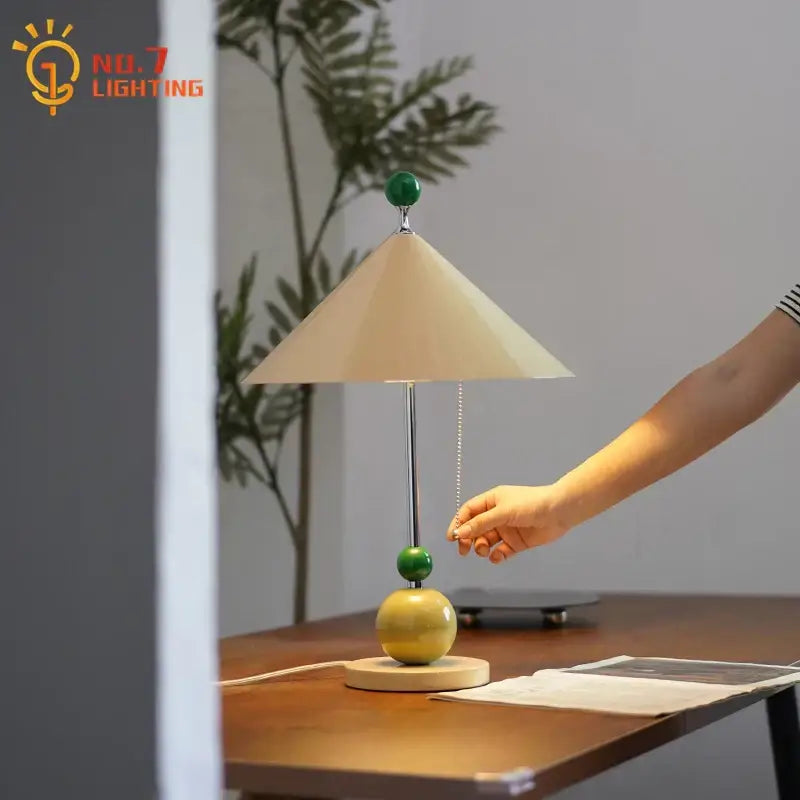 A decorbites colorful led umbrella table lamp with beige shade chrome stem and green yellow resin base accents for bedroom