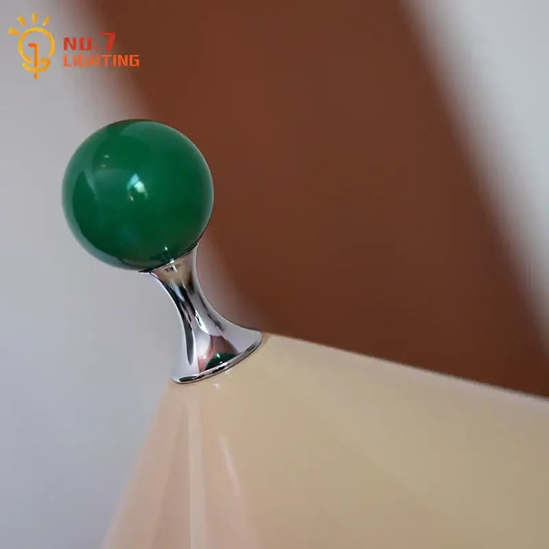 A polished emerald green spherical knob on a chrome stem for decorbites colorful led umbrella table lamp