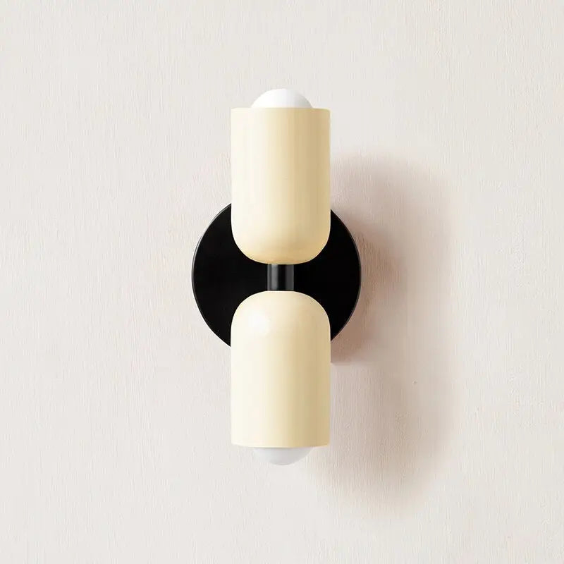 Cream-colored modern wall sconce by DecorBites with black base and two frosted glass shades for elegant lighting