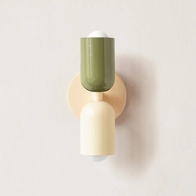 Olive green and cream modern wall sconce with sleek cylindrical glass shade from decorbites™ colorful modern wall design