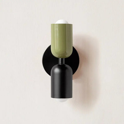 Decorbites™ olive-green modern wall sconce with a glass shade, matte black base, and circular backplate for indoor use