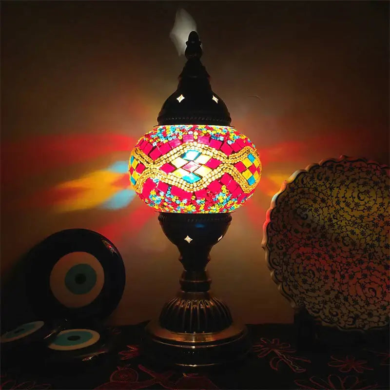 Decorbites colorful mosaic table lamp with a vibrant stained glass globe and ornate brass base for bedroom use
