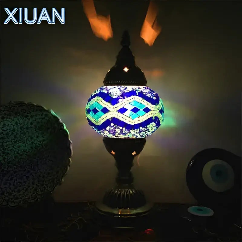 Decorbites colorful mosaic table lamp with blue and white glass tiles on ornate black metal base for bedroom use