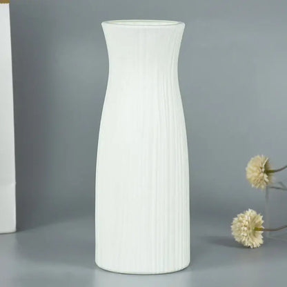 A tall slender white ceramic modern flower vase with vertical ribbed texture for home décor by DecorBites™