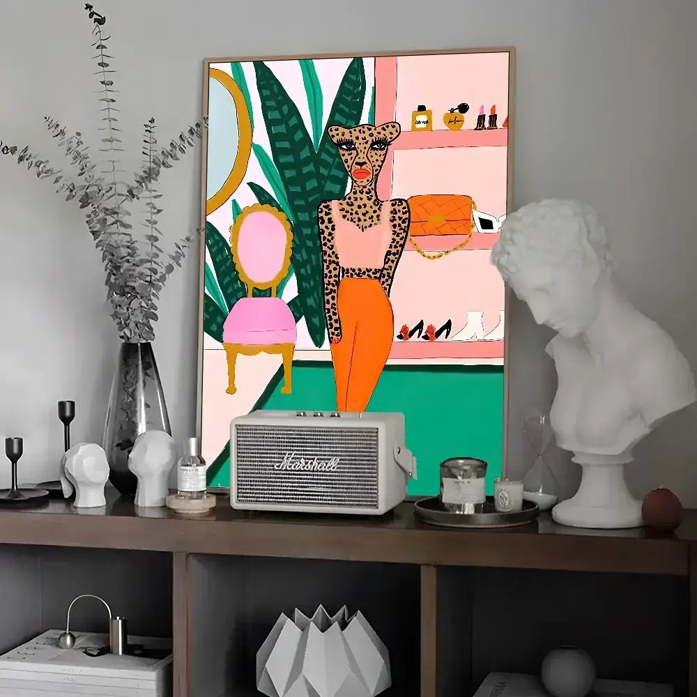 White marshall speaker with grille and silver logo featured alongside colorful tiger and leopard vintage poster wall art