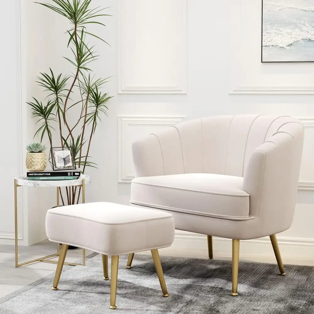 Cream-colored velvet decorbites comfortable beige bucket armchair with gold-tone metal legs and matching ottoman for living room