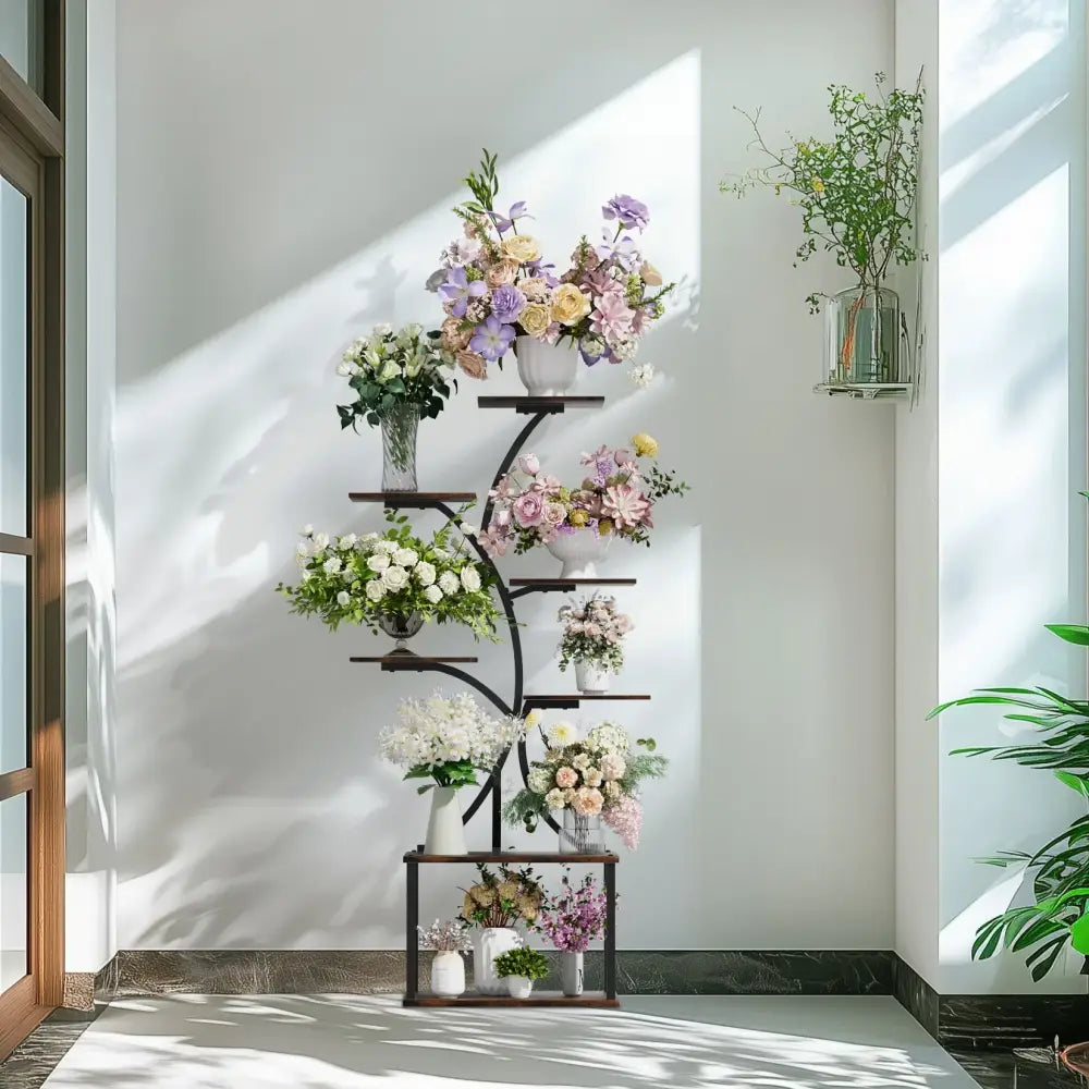 DecorBites™ compact tree design black metal plant stand with multiple curved shelves displaying colorful floral arrangements