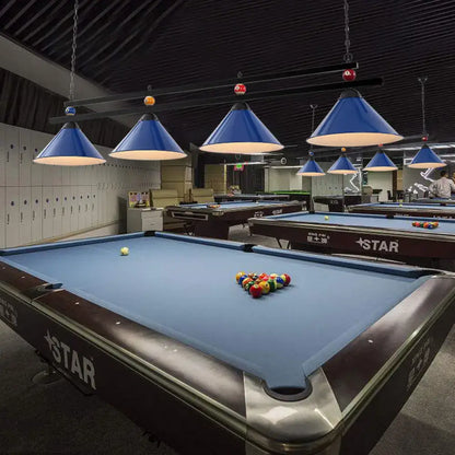 Blue felt pool table with dark brown wooden frame and silver metallic rails beside DecorBites metal pendant ceiling light
