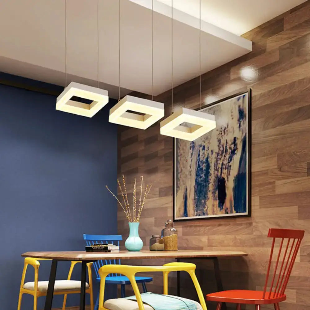 Modern silver acrylic square island light with white natural minimalist pendant lights hanging from ceiling