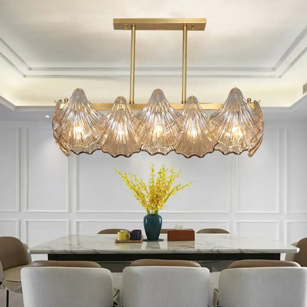 Decorbites contemporary amber crystal pendant light with five translucent glass shells and brass island lighting linear metal arm
