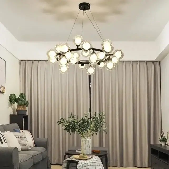 Modern black metal chandelier featuring multiple frosted white glass ball bulbs from DecorBites™ collection