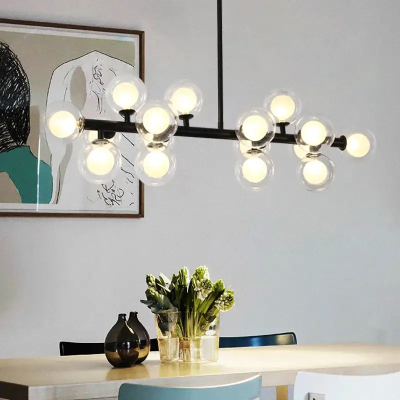 Modern black metal chandelier featuring multiple clear white glass ball bulbs for contemporary decor by DecorBites