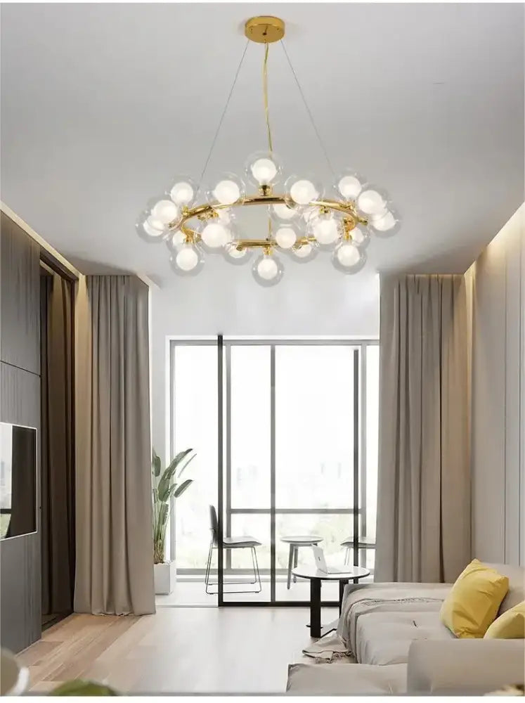 DecorBites™ contemporary black and gold chandelier with white glass balls arranged in a circular pattern