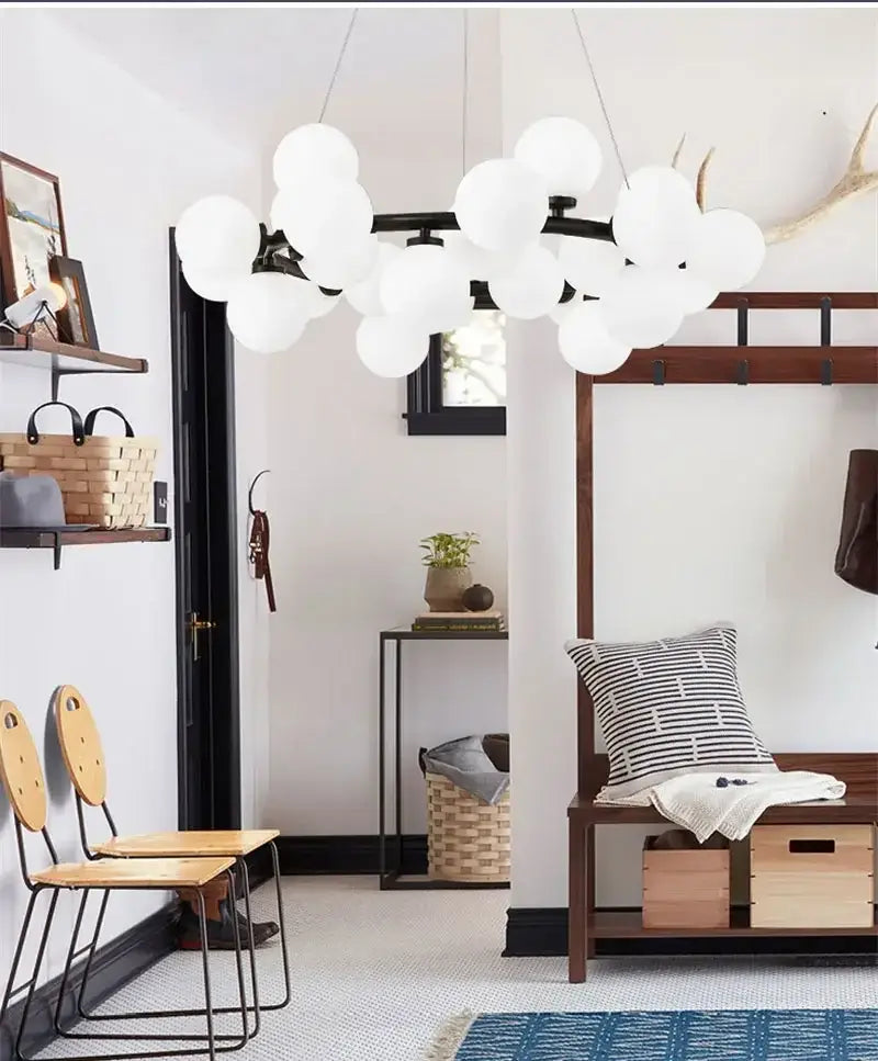 Decorbites™ contemporary black and gold chandelier featuring a white glass ball pendant light with a black metal frame