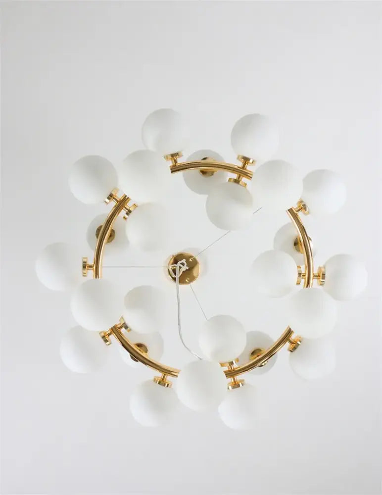 Decorbites™ contemporary black and gold chandelier featuring multiple frosted white glass balls in a circular pattern