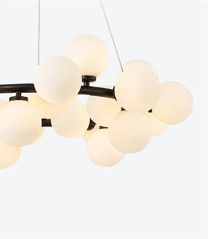 DecorBites™ contemporary black and gold chandelier with modern black metal frame and white glass ball shades