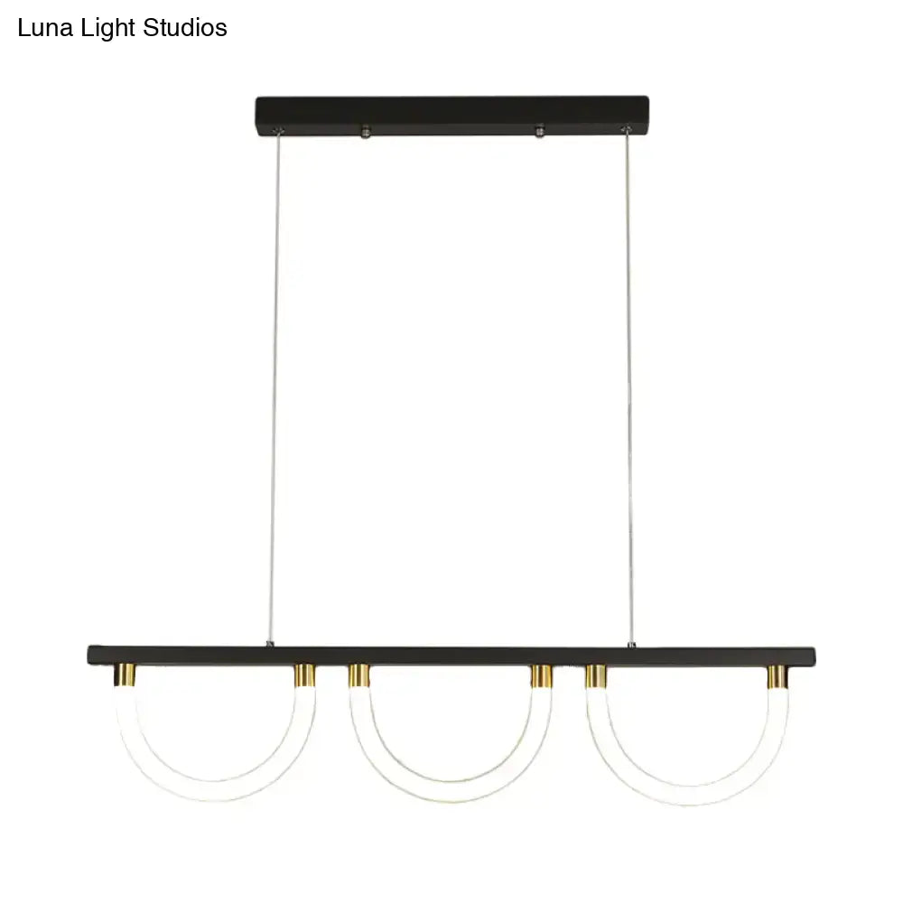 Decorbites contemporary island lamp with black and gold finish and three clear acrylic semicircle shades for kitchen island