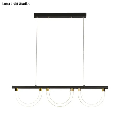 Decorbites contemporary island lamp with black and gold finish and three clear acrylic semicircle shades for kitchen island