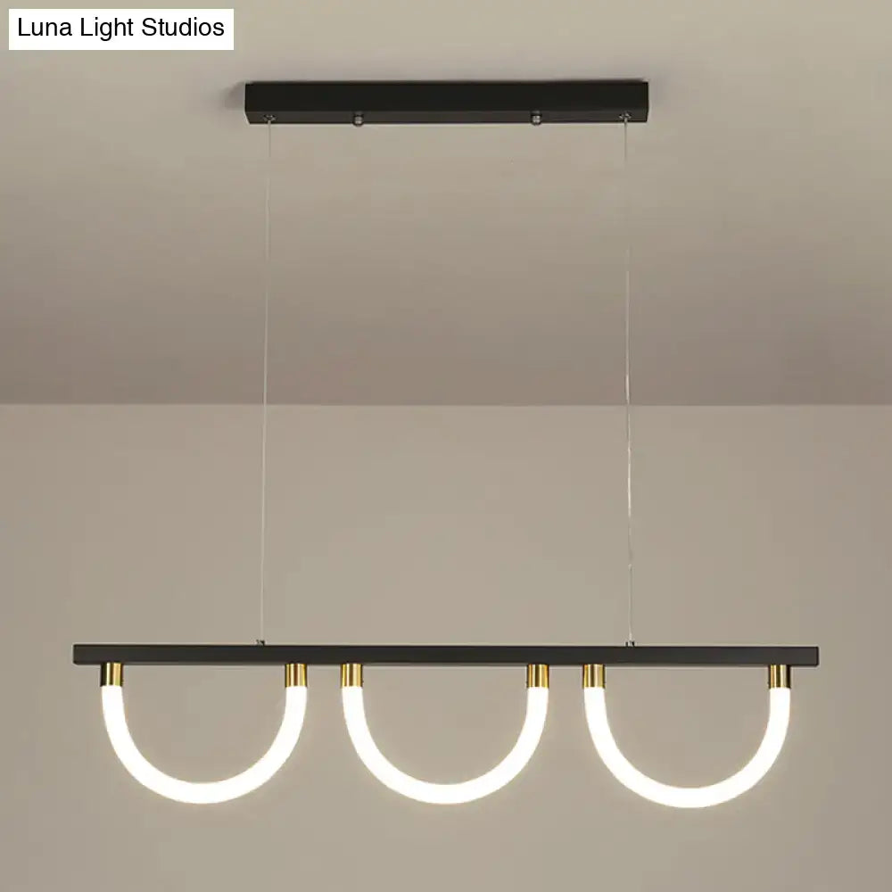Modern black and gold DecorBites contemporary island lamp with three curved acrylic led rings for kitchen island lighting