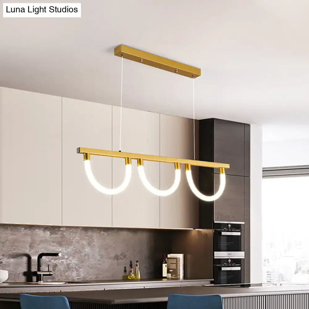Gold-toned acrylic semicircle contemporary island lamp with three curved illuminated rings for kitchen island lighting