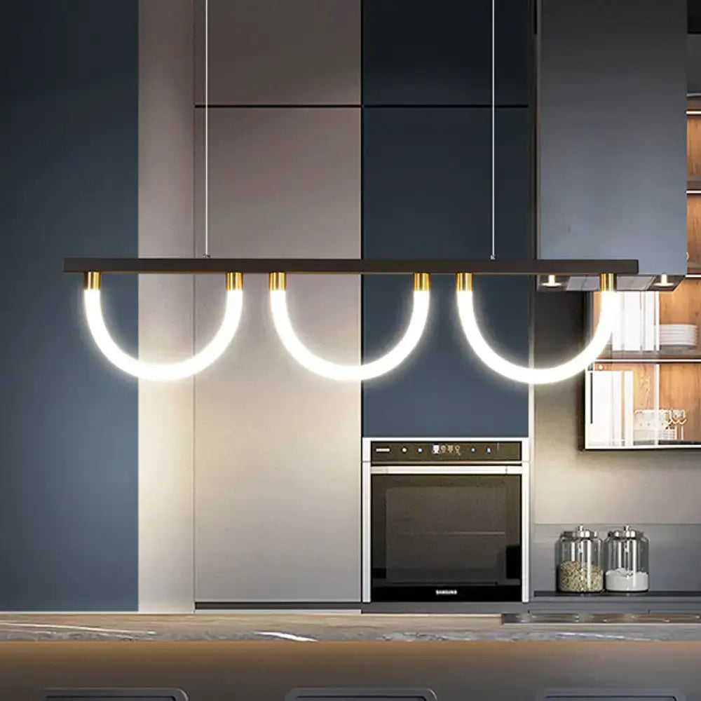 Decorbites contemporary island lamp with black rectangular frame, gold fixtures, and three curved white led strips