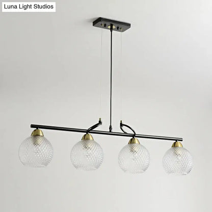 DecorBites contemporary black metal pendant light with four clear prismatic glass globes and brass accents for dining hall