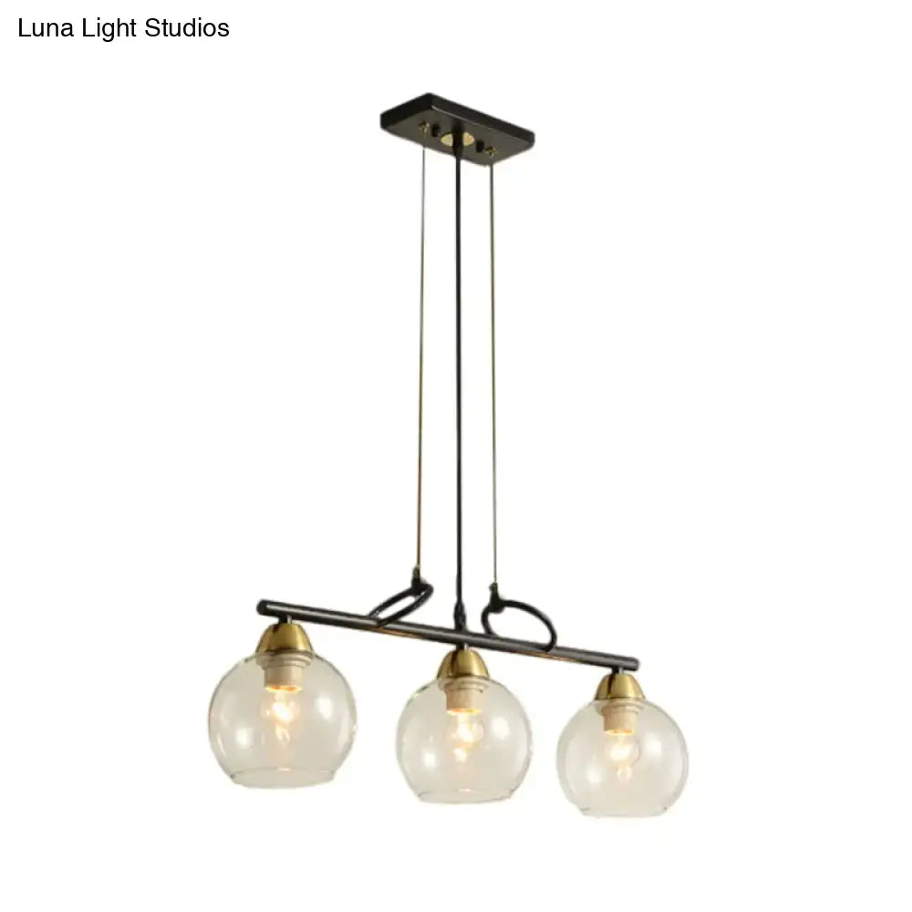 DecorBites contemporary black metal chandelier with clear prismatic glass globes and brass accents for dining hall lighting
