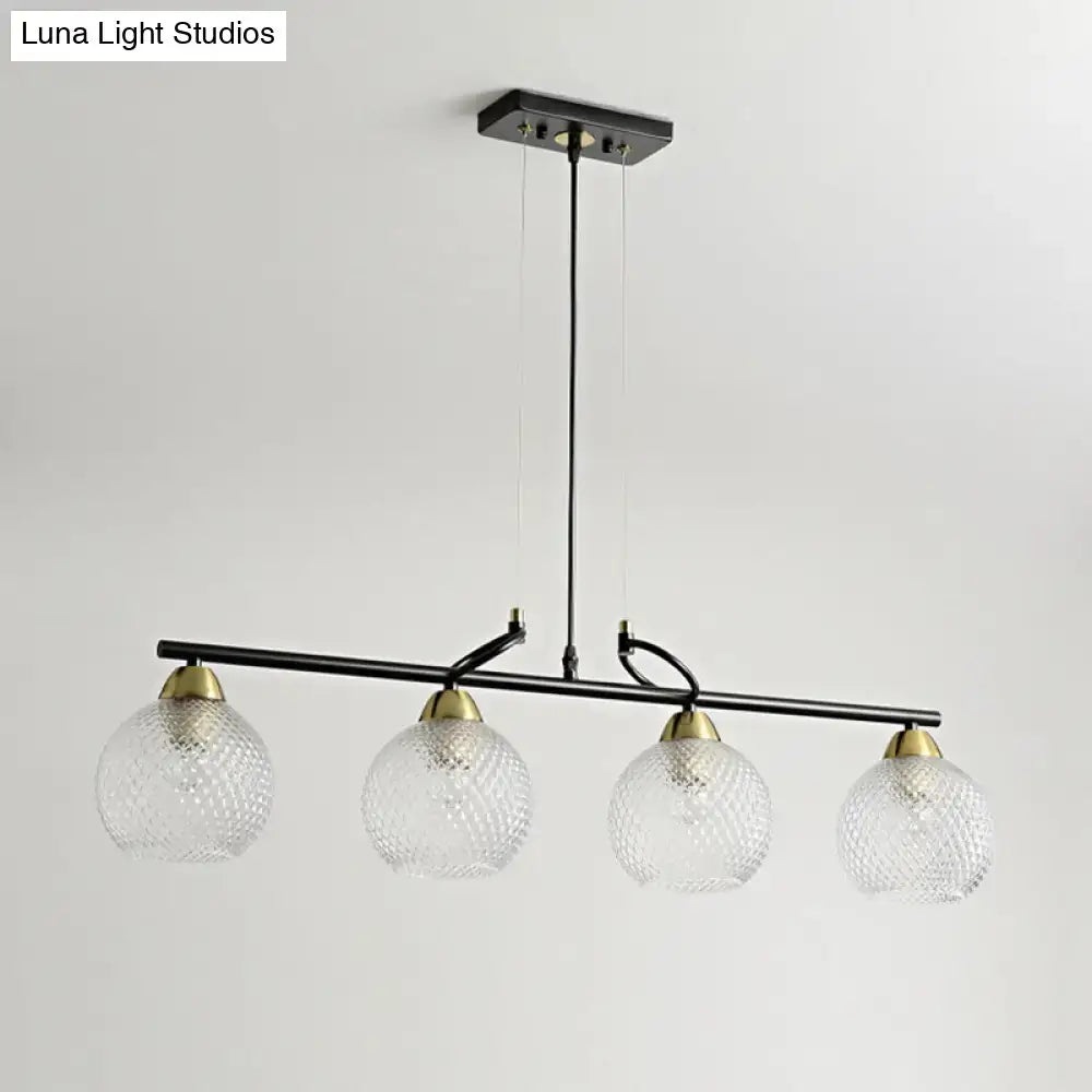 Contemporary black metal chandelier with clear prismatic glass globes and brass accents for dining hall lighting