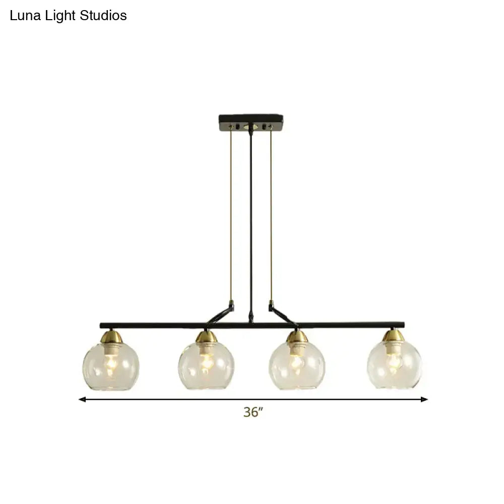 Decorbites contemporary black metal pendant light with four clear prismatic glass globes and brass accents for dining hall