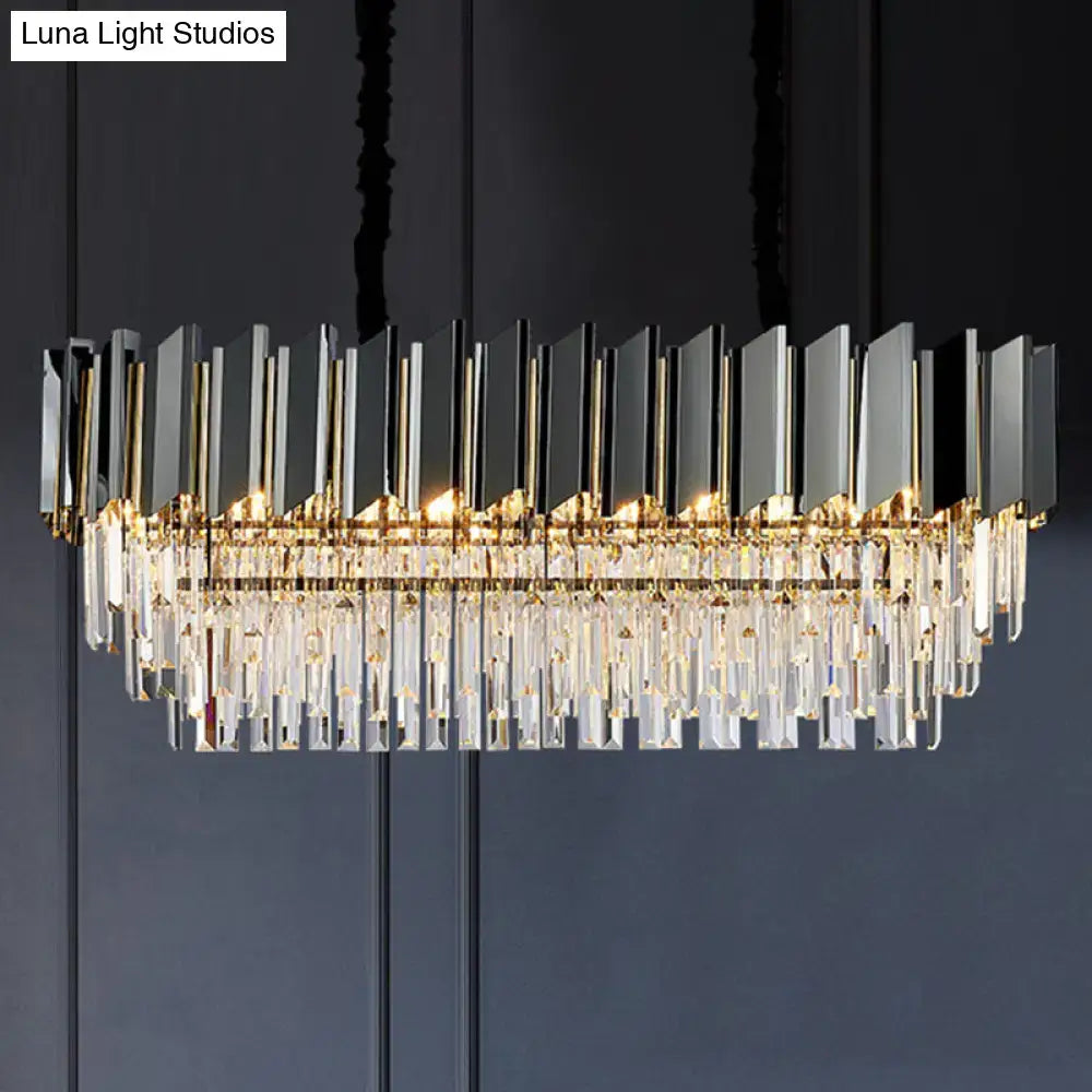 Modern rectangular chandelier with gold metal frame black mirrored panels and crystal prisms for dining room lighting