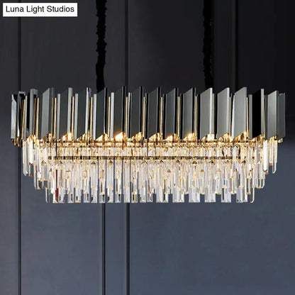 Modern rectangular chandelier with gold metal frame black mirrored panels and crystal prisms for dining room lighting