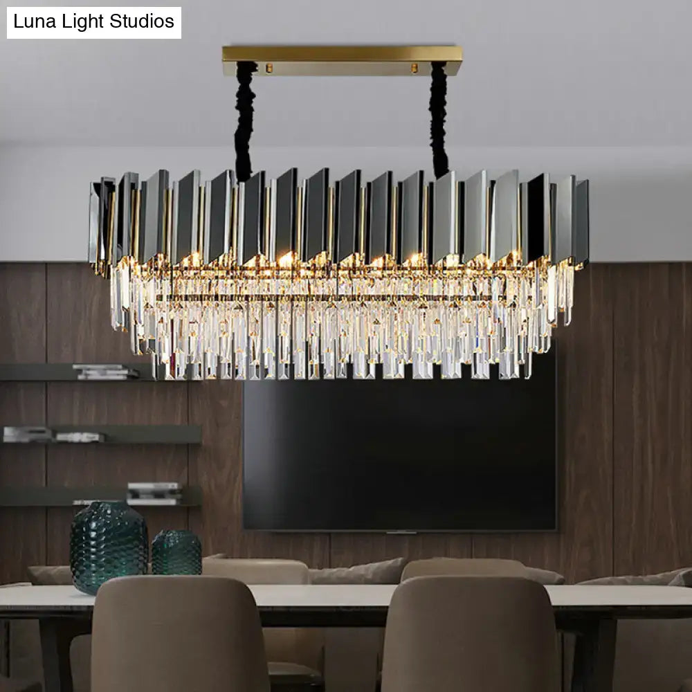 Modern rectangular DecorBites™ chandelier with gold metal frame, black silver panels, and crystal prisms for dining room