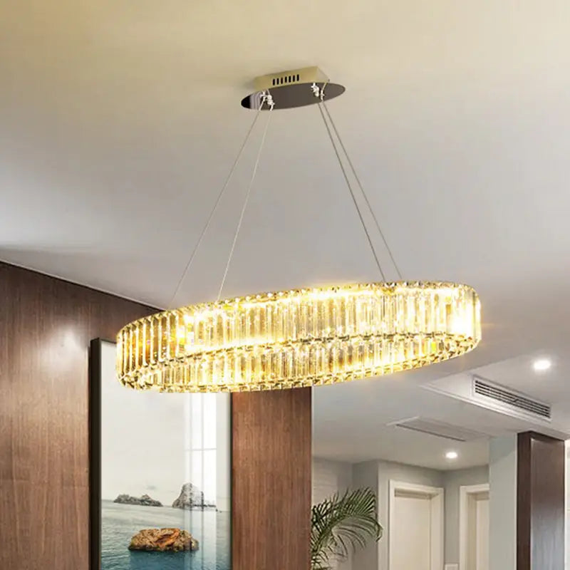 Golden crystal chandelier with modern circular design and hanging chains featuring stepless dimming for dining table lighting