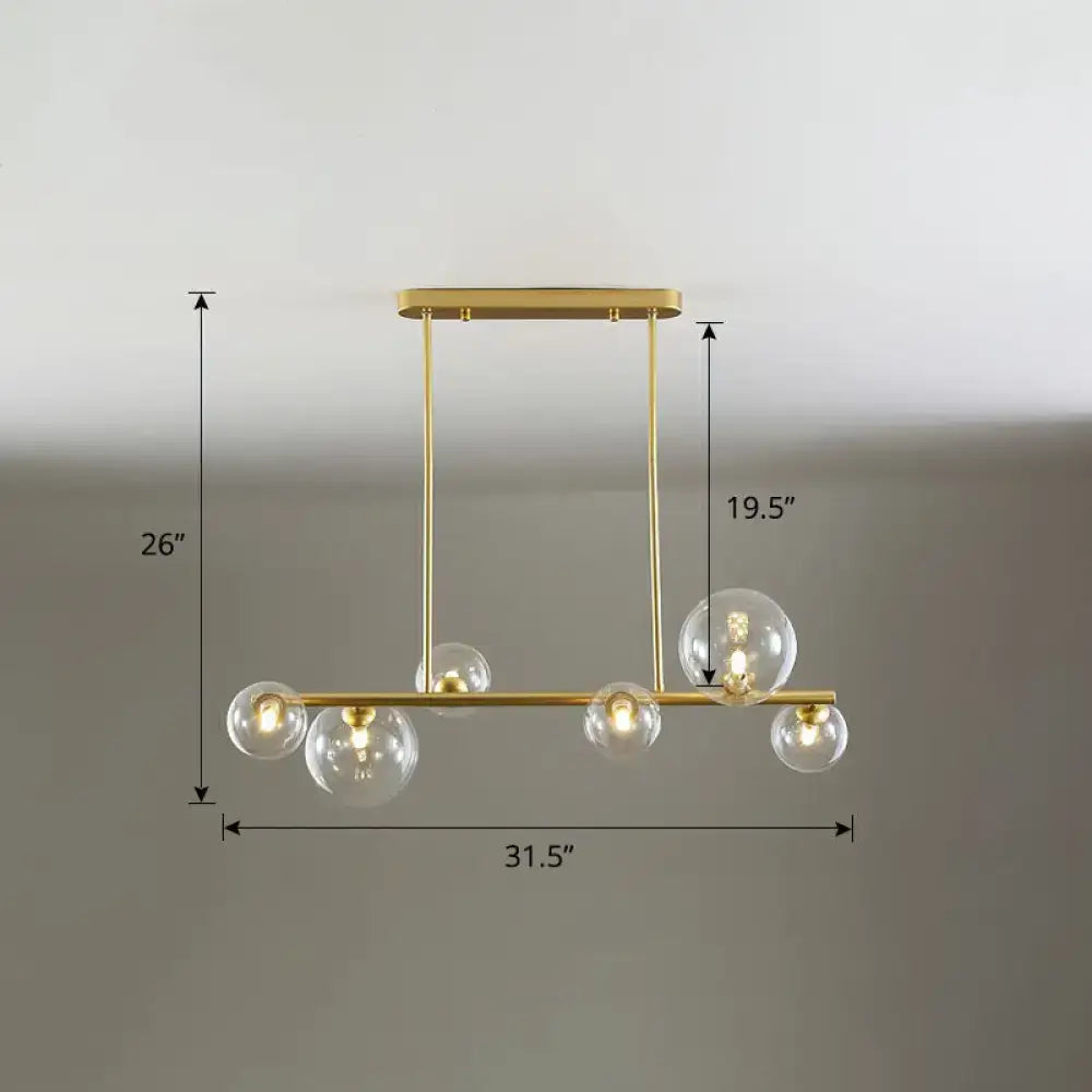 Gold-toned DecorBites™ contemporary ceiling light with five clear glass globes for dining room island lighting