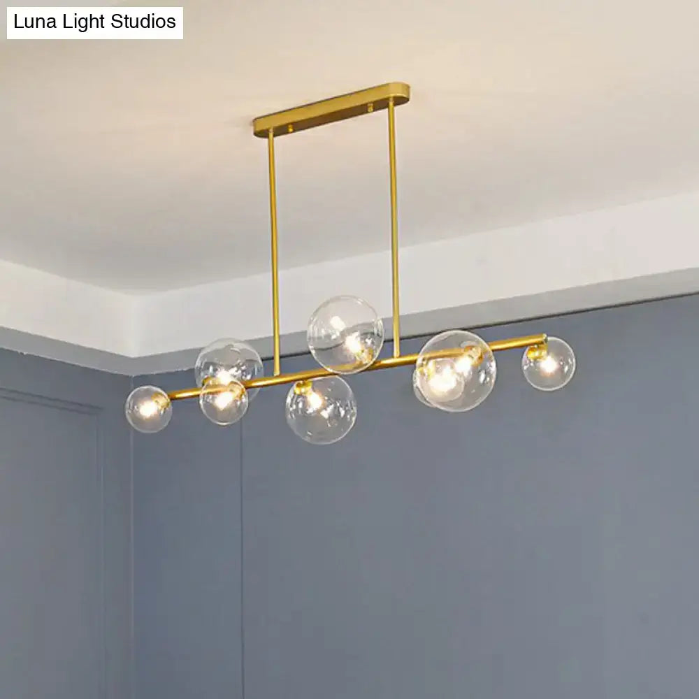 Gold-toned DecorBites™ contemporary ceiling light with clear glass globe bulbs for stylish dining room decor