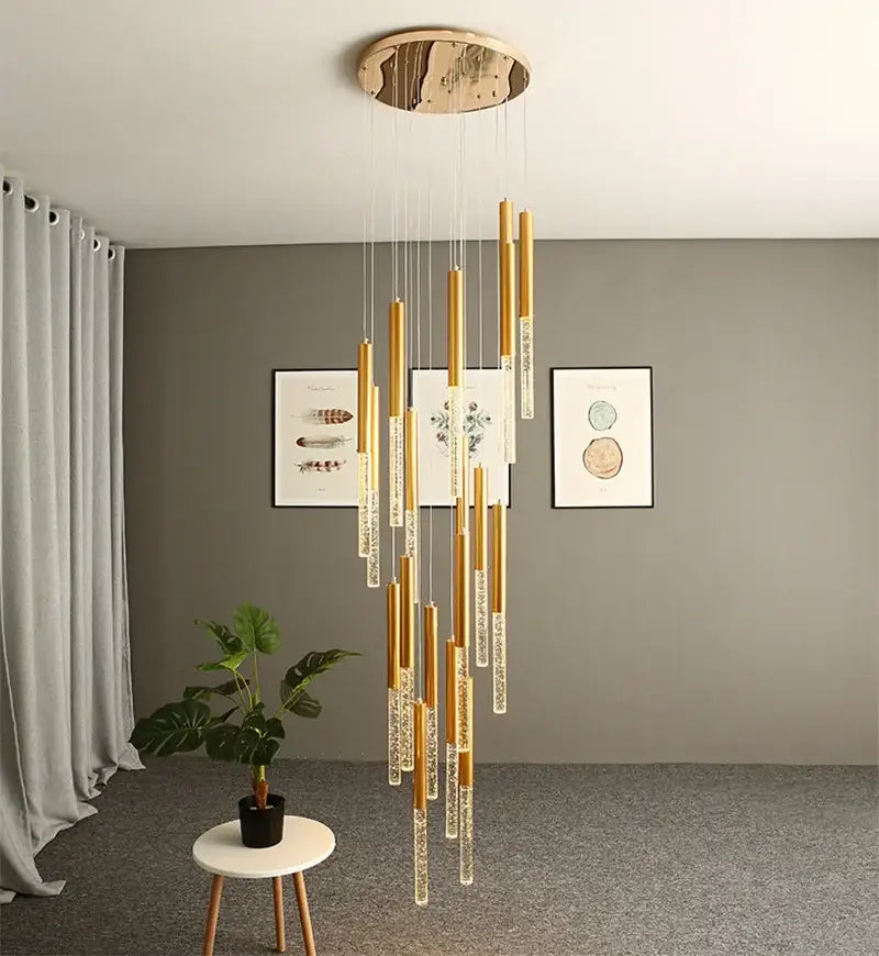 DecorBites™ contemporary crystal chandelier with gold-toned finish and clear crystal accents for large staircase lighting