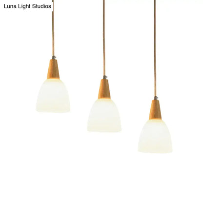 DecorBites™ contemporary 3-light beige suspension lamp with frosted glass dome shades and warm wood accents