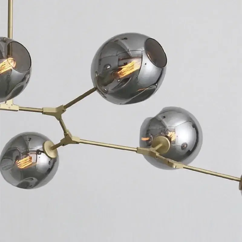 DecorBites™ contemporary glass bubble chandelier with polished chrome spherical shades and brass-colored metal arms for living room