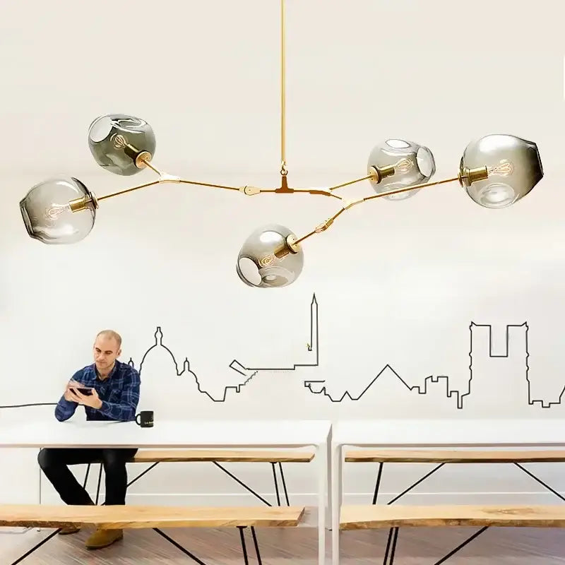 Modern gold-toned DecorBites™ glass bubble chandelier with five smoked glass globe bulbs for living room lighting