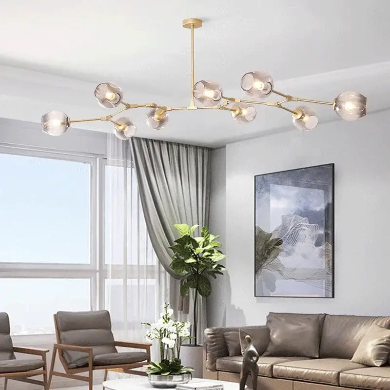 Gold-toned decorbites™ contemporary glass bubble chandelier with clear glass globes for living room lighting