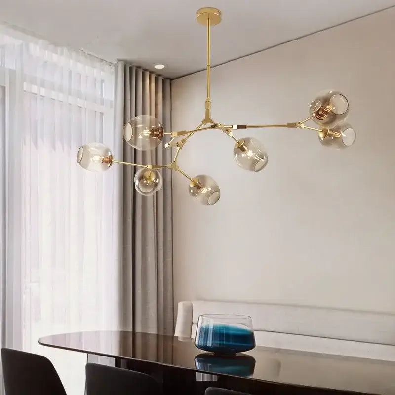 Gold-toned DecorBites contemporary glass bubble chandelier with clear glass globe bulbs for living room lighting