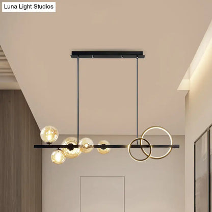 Decorbites contemporary 7-head island lamp with modern black and gold rings and smoke grey glass bulbs for dining room