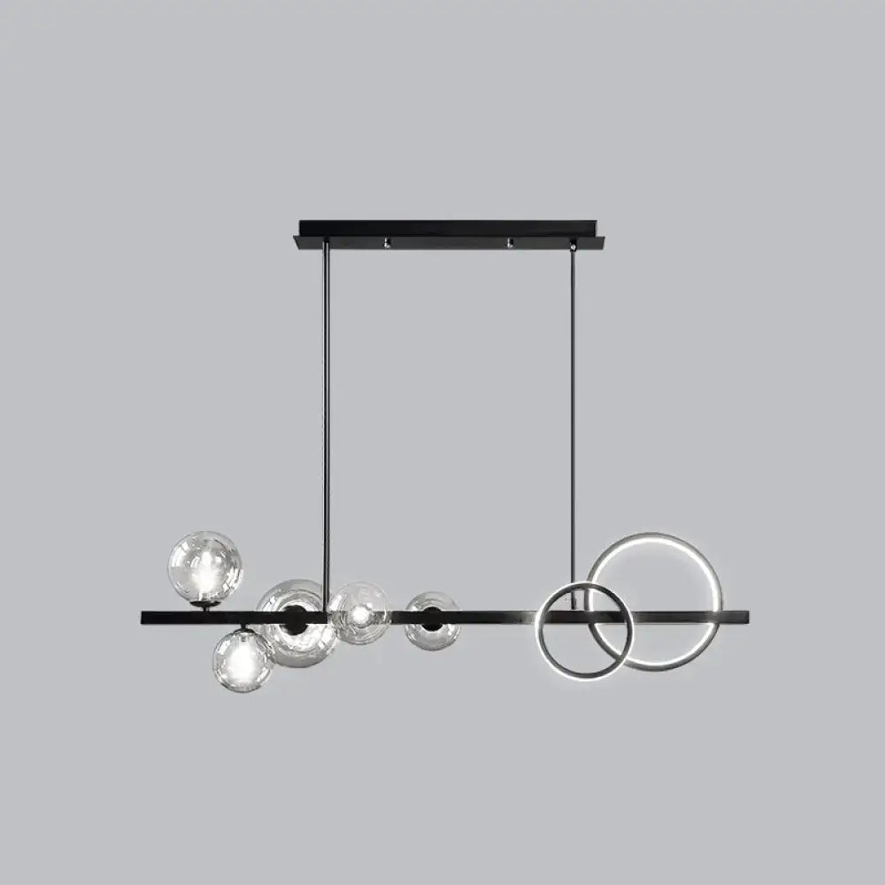 Decorbites modern black metal island lamp with clear glass spheres and glowing rings for dining room lighting