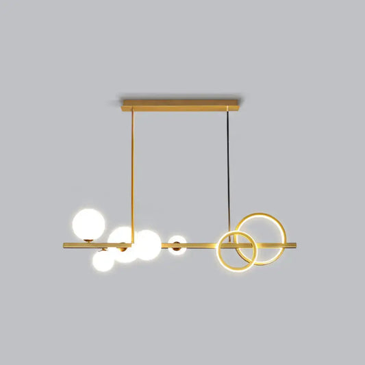 Decorbites contemporary glass island lamp with gold-toned pendant, milk white spherical bulbs, and smoke grey rings