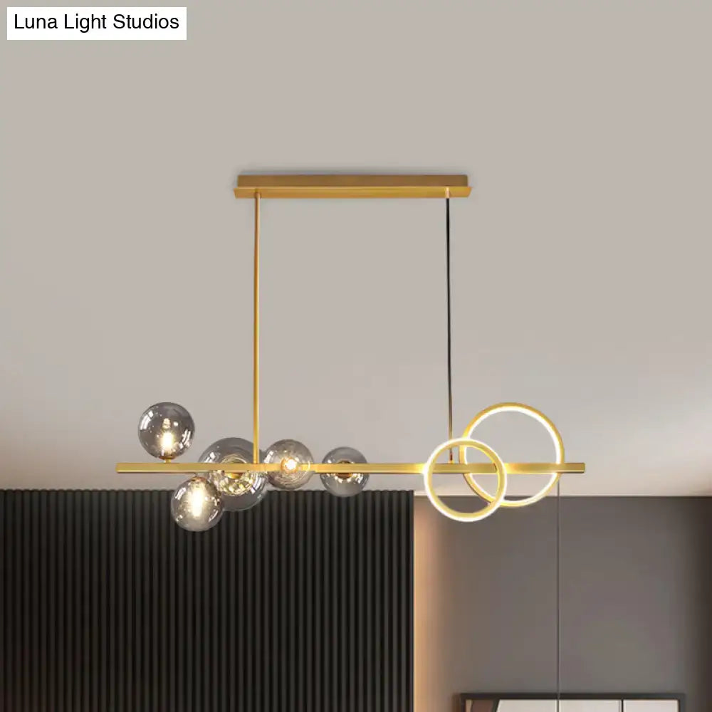 DecorBites™ contemporary gold-toned island lamp with milk white glass spheres and interlocking rings for dining room